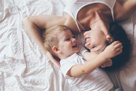 Woman and child smiling at each other representing legal guardianship 