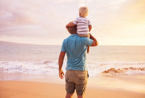 Male parent with child on their shoulders symbolizing custody