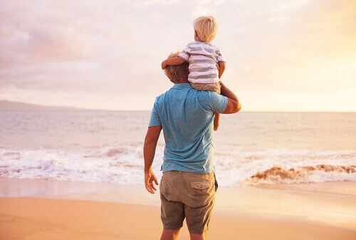 Male parent with child on their shoulders symbolizing custody